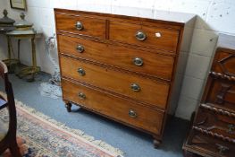 A George III mahogany straight front chest of two short and three graduated long drawers on turned