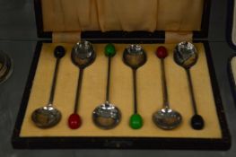 A cased set of six silver coffee spoons.