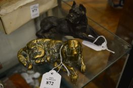 A cast brass dog shaped inkwell and another metal model of a dog.