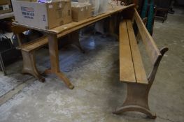 An unusual hardwood refectory style table and pair of bench seats.