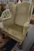 A good large George III design wing armchair on carved claw and ball feet.
