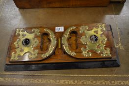 A good Victorian Betjemanns patent walnut book slide with brass and agate cabochon decoration.