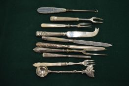 Silver handled and other button hooks, forks and other items.