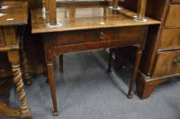 An 18th century oak single drawer side table on turned legs with pad feet.