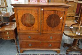 A good Edwardian mahogany press cupboard with a pair of doors above two long drawers on bracket
