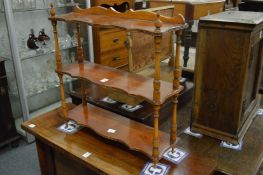 A yew wood hanging wall shelf.