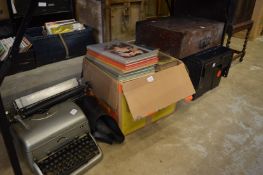 Records, printing set, books and an old typewriter.