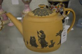 A Wedgwood Caneware teapot, early 19th century decorated in the domestic employment pattern (chip to
