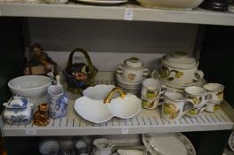 Shelf of decorative china.