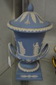 A pair of large Wedgwood pale blue jasperware classical style urns and covers.