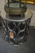 A pair of unusual silvered metal occasional tables formed as rows of horseshoes.
