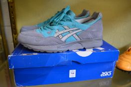 Three pairs of trainers and a pair of football boots, various makers and sizes.