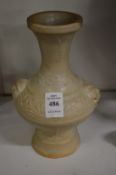 A Chinese pale celadon glazed bottle vase.