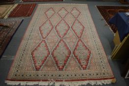 Persian style rug with geometric decoration, 260cm x 162cm.