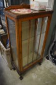 An oak display cabinet.