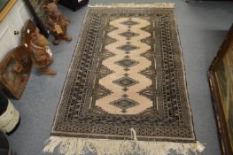 A Persian design rug, cream ground with stylised decoration, 158cm x 97cm.