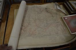 A group of ordnance survey maps, rolled and unframed.