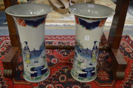 A good large pair of Chinese trumpet shaped vases decorated with figures in a landscape.