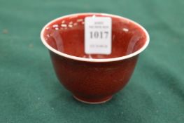 A Chinese small sang de boeuf bowl.