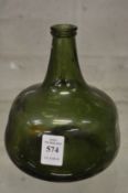 An 18th century green glass onion or globe shaped wine bottle.