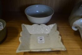 Two Chinese pale celadon dishes.