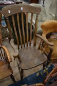 A beech and elm lath back Windsor armchair.