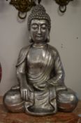 A silvered resin model of a seated Buddha.