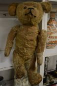 An old teddy bear, well loved.