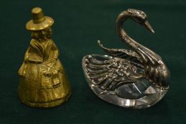 A swan shaped, cut glass and metal mounted salt together with a brass bell.