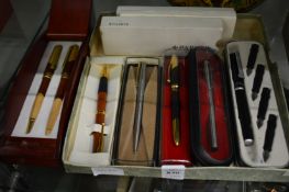 Various boxed pens.