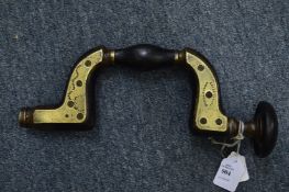 An early brass and ebony filled carpenters brace by Alfred Ridge.