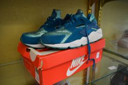 A pair of Nike Air Huarache Green Abyss size 12, boxed.