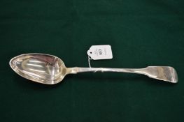 A silver serving spoon.