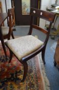 A set of five Regency mahogany dining chairs.