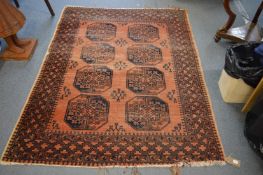 An Afghan rug, rust ground with four rows of gulls, 190cm x 145cm.