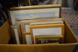 A box of paintings and prints.