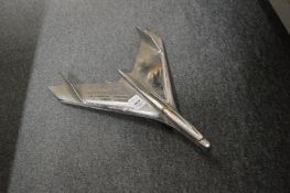 An original chrome car mascot modelled as a bird.