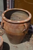 A good large glazed earthenware planter with ring handles.