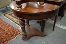 A Victorian walnut demi-lune side table.