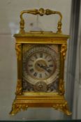 A good French brass carriage clock with alarm, striking on the hour and half hour with a repeat