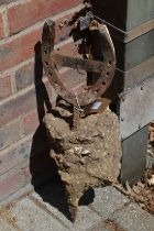 A horseshoe shaped boot scraper.