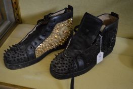 A pair of Christian Louboutin gold and black studded ankle boots together with a pair of Kurk Geiger