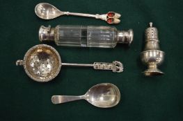 A pepperette, sifter spoon and other items to include a double ended scent bottle.