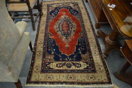 A good old Persian rug, red ground with stylised decoration, 239cm x 115cm.