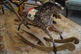An early painted rocking horse on pine base (faults).