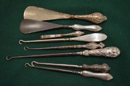 Silver handled button hooks and shoe horns.