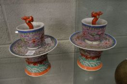 A pair of Chinese famille rose porcelain pedestal pastel burners with removal upper sections.