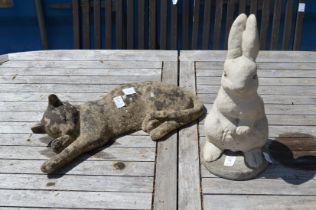 Garden ornaments modelled as a rabbit and a sleeping cat.