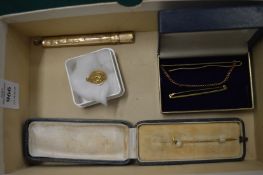 A 9ct gold tie clip and other items.