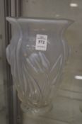 An opaque glass vase, moulded decoration depicting flowers.